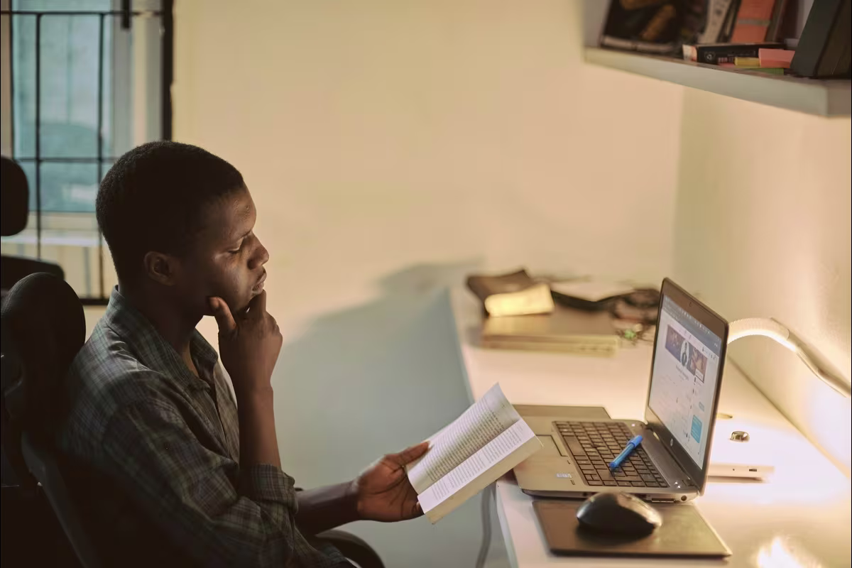 A diverse team of remote employees engaging with localized digital training content on multiple devices