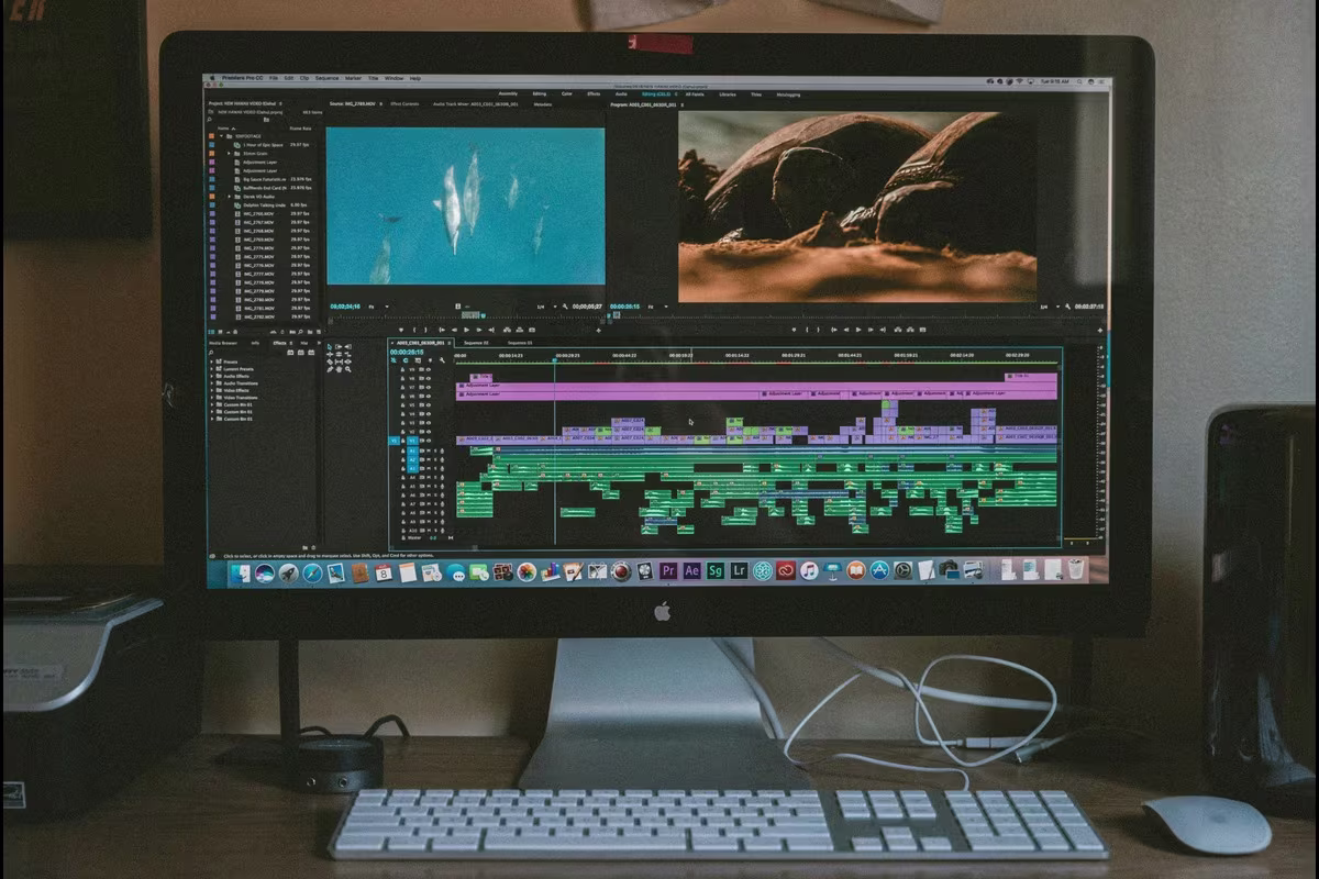 A B2B brand marketing team reviewing localized video content on multiple screens for global market deployment